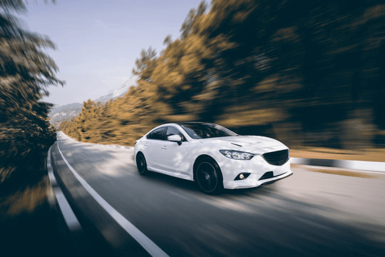 A white car on a road