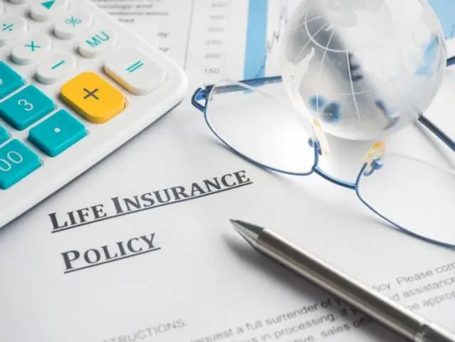 a pen and glasses on a life insurance policy form