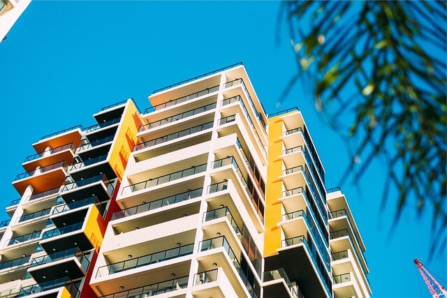a multistory condo building with balconies