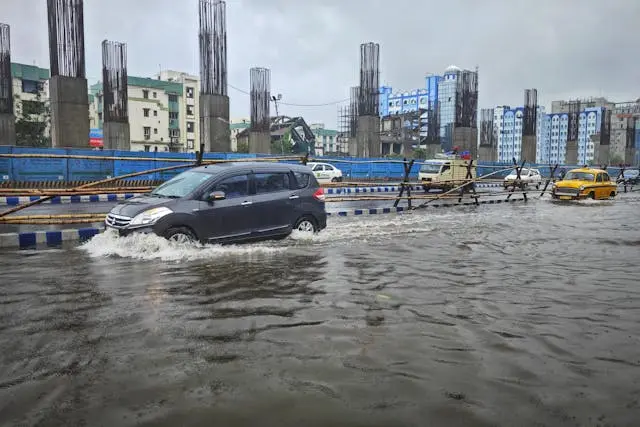 a car driving through a flooded road