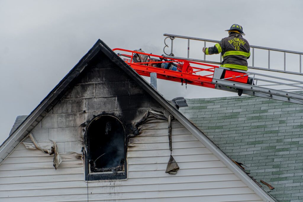 Firefighter at a fire-damaged Branson, MO home.